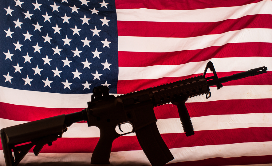 AR-15 type assault rifle silhouette on american flag