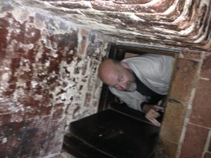 Padre clambering into the priest's hole